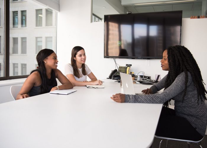three women sitting at the table